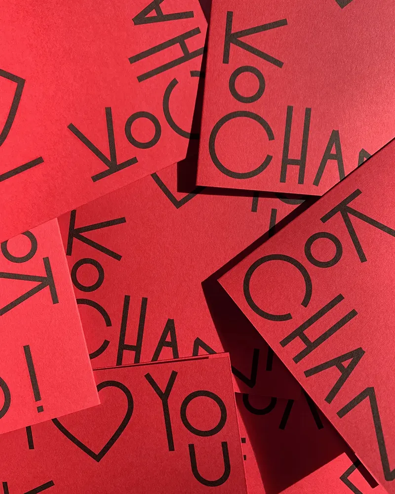 Scattered red cards with bold black text reading 