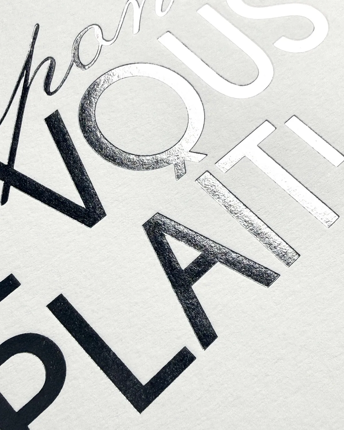 Close-up of the Amalfi suite RSVP card, silver hot foil on Colorplan natural.