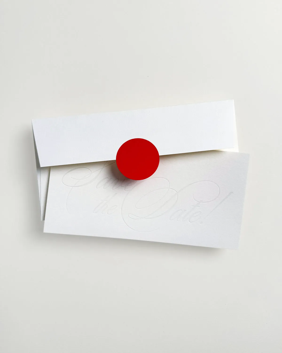 Contemporary Aspen Suite Save the Date card and envelope in striking Bright Red by The Goodest Stationery.