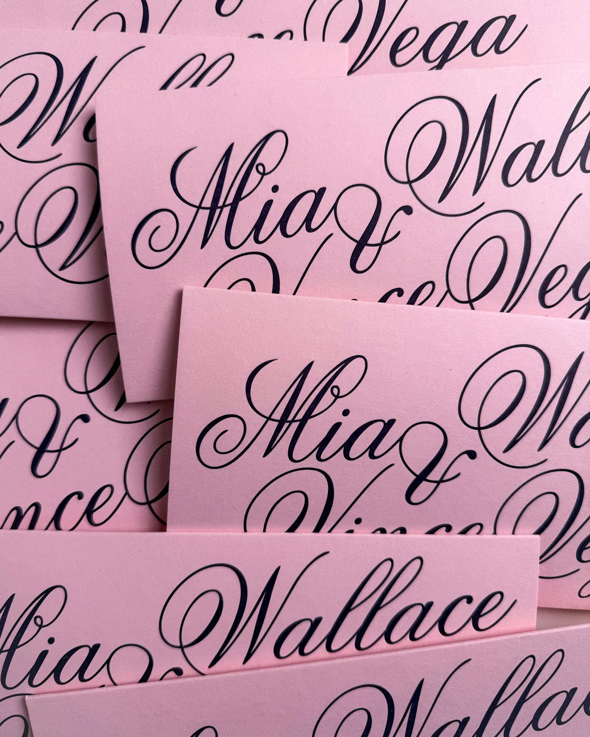 Close-up of luxury letterpress Poppy Suite invitation card in pastel tones by The Goodest Stationery Company.
